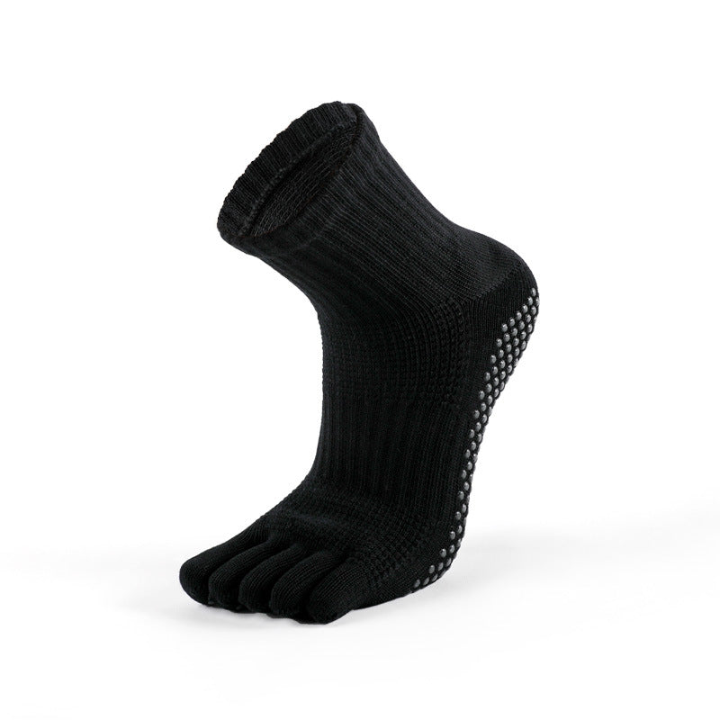 Silicone grip dots on men’s black five-toe ankle socks