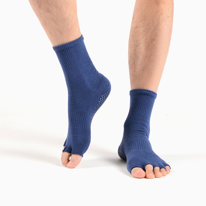 Model wearing open-toe grip socks during yoga movement and balance