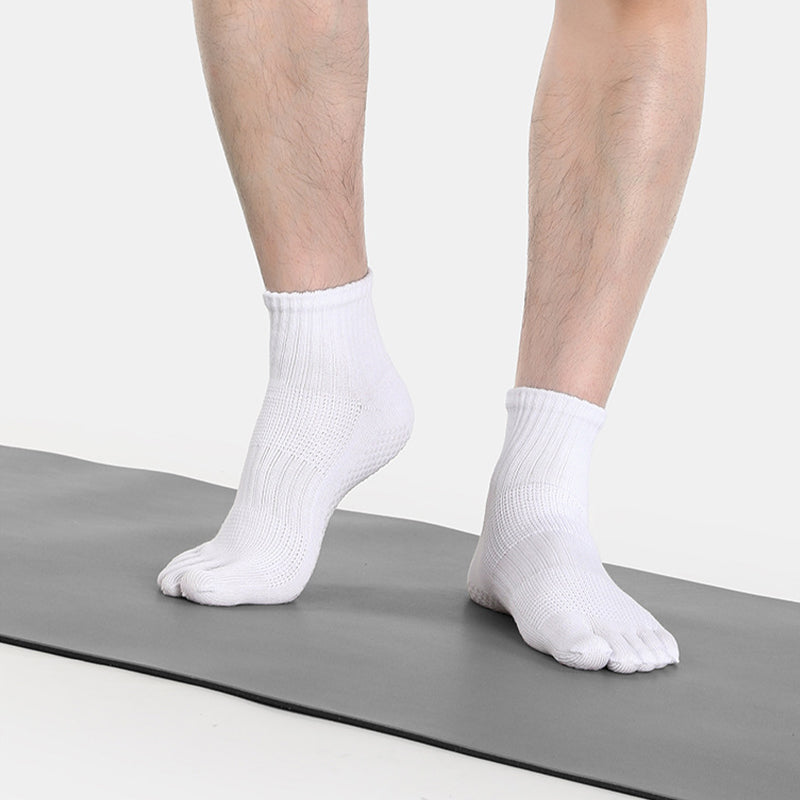 Men wearing five-toe grip socks for yoga and studio exercise