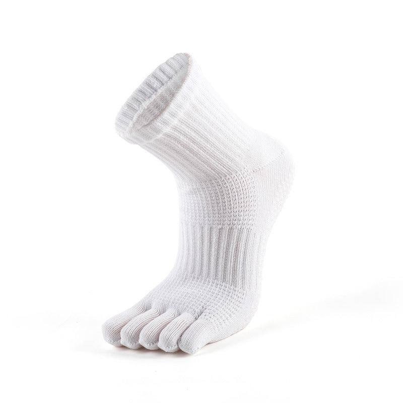 Silicone grip dots on men’s white five-toe ankle socks