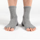 Studio-ready yoga socks with open toes and secure grip for balance